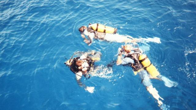 Blue sea with divers